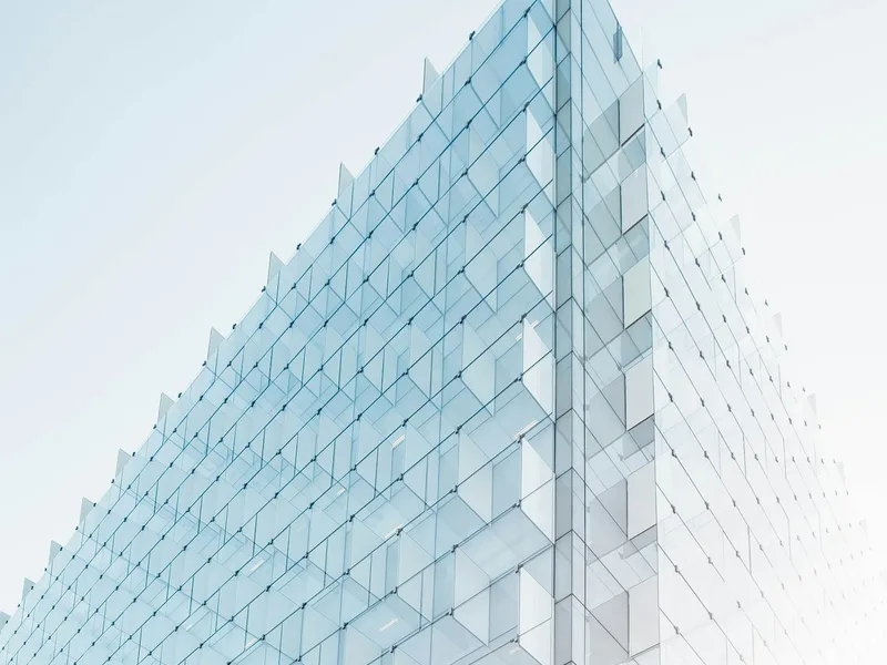 Glass façade with clear geometric lines — a symbol of digital design